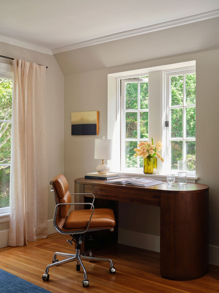 Inspiration for a transitional freestanding desk medium tone wood floor and brown floor home office remodel in San Francisco with beige walls