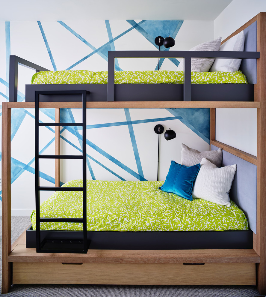 Design ideas for a contemporary gender-neutral kids' bedroom for kids 4-10 years old in San Francisco with multi-coloured walls, carpet and grey floor.