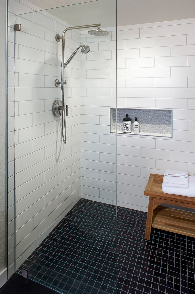 Example of a mid-sized farmhouse master white tile and subway tile porcelain tile and black floor walk-in shower design in San Francisco with white walls and an undermount sink