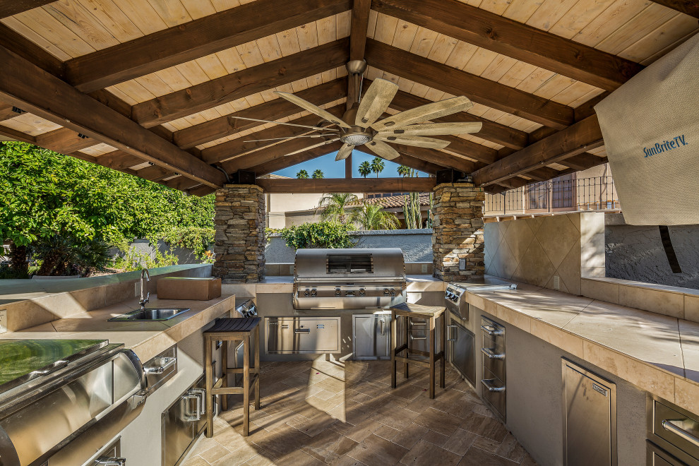 Inspiration for an expansive modern backyard patio in Phoenix with an outdoor kitchen and a gazebo/cabana.