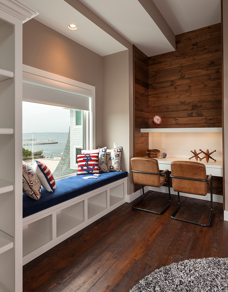 Study room - large modern dark wood floor and brown floor study room idea in New York with brown walls