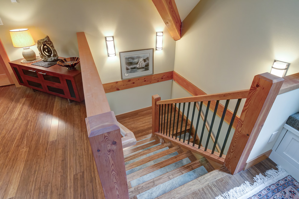 Photo of a mid-sized arts and crafts tile u-shaped staircase in Seattle with wood risers and mixed railing.