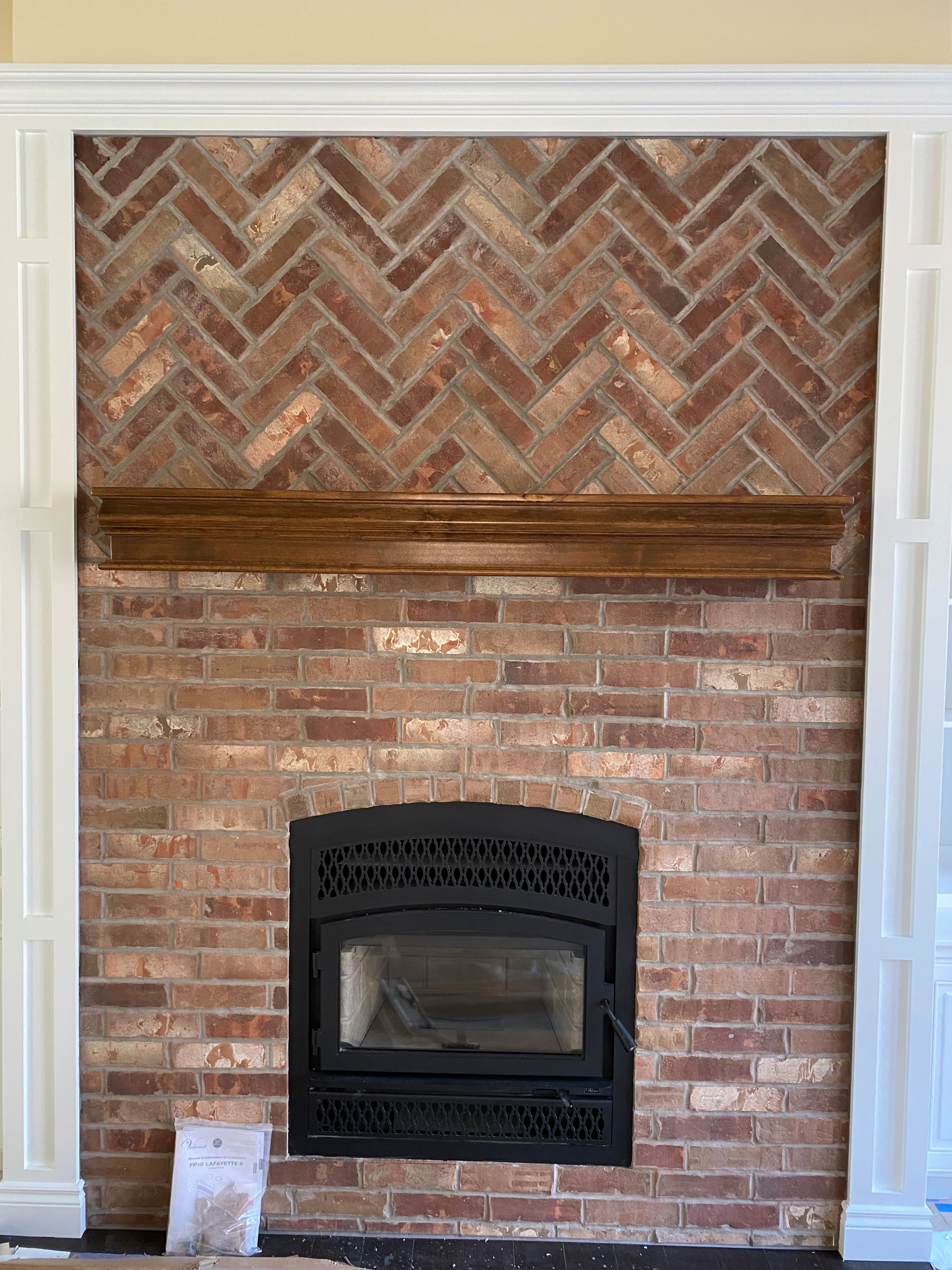 Wood burning fireplace with brick front detail
