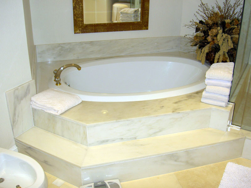 Inspiration for a blue tile and ceramic tile marble floor corner shower remodel in Miami with marble countertops, a hot tub and beige walls