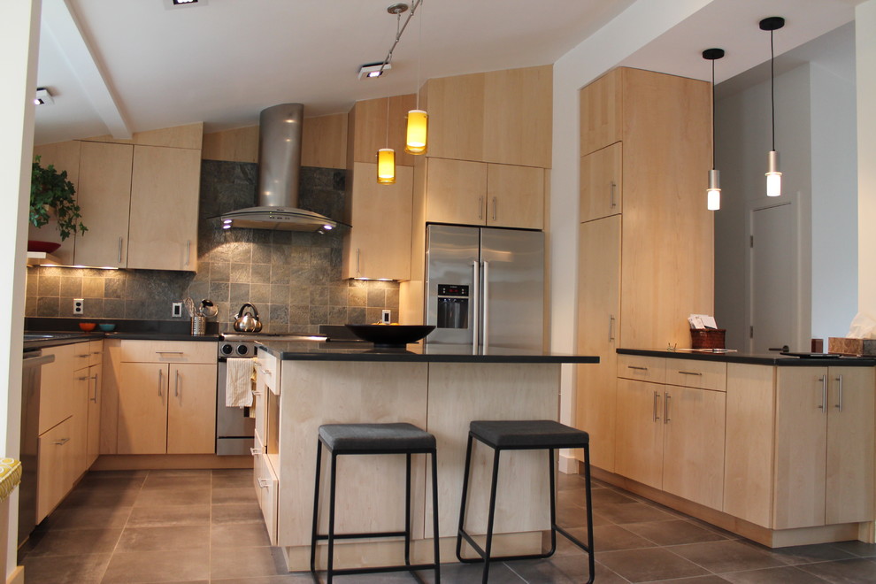 Photo of a contemporary u-shaped kitchen in Boston with flat-panel cabinets, light wood cabinets and slate splashback.