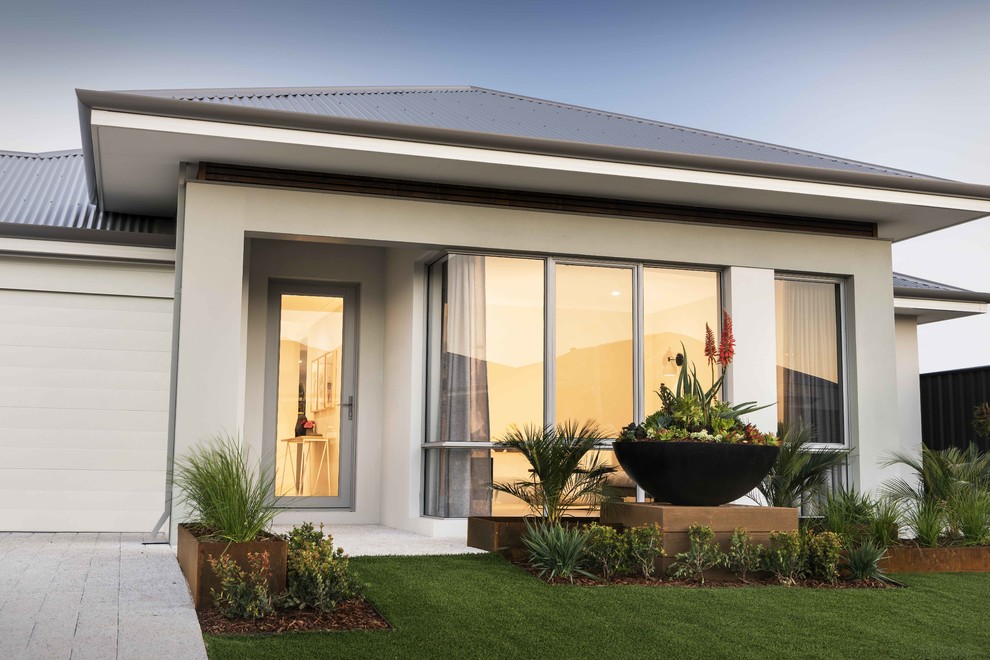 This is an example of a mid-sized contemporary one-storey stucco grey house exterior in Perth with a gable roof and a metal roof.