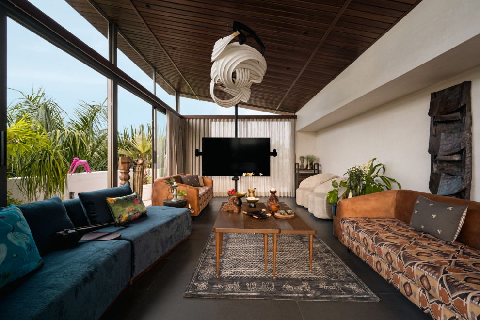 Contemporary living room in Ahmedabad With White Walls, No Fireplace and a Wall-mounted TV.