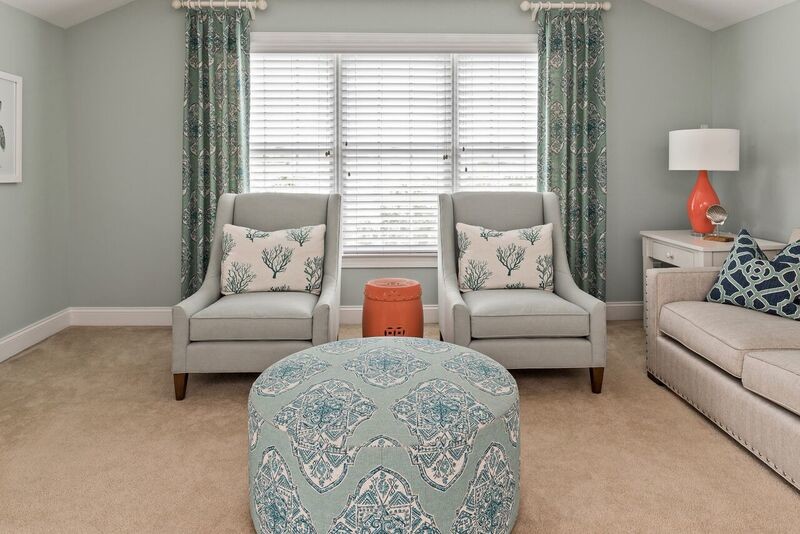 Photo of a large transitional family room in Charlotte with blue walls and carpet.