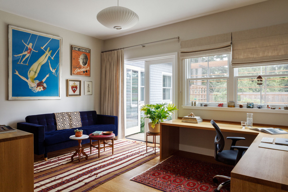 Example of a mid-century modern home office design in San Francisco