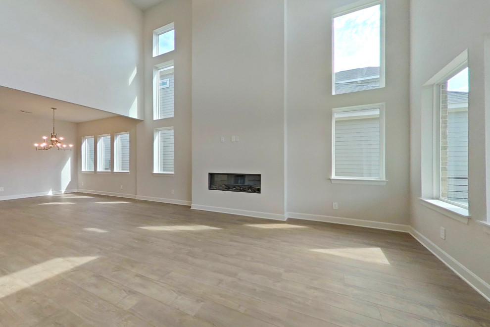 This is an example of a large modern living room in Houston.