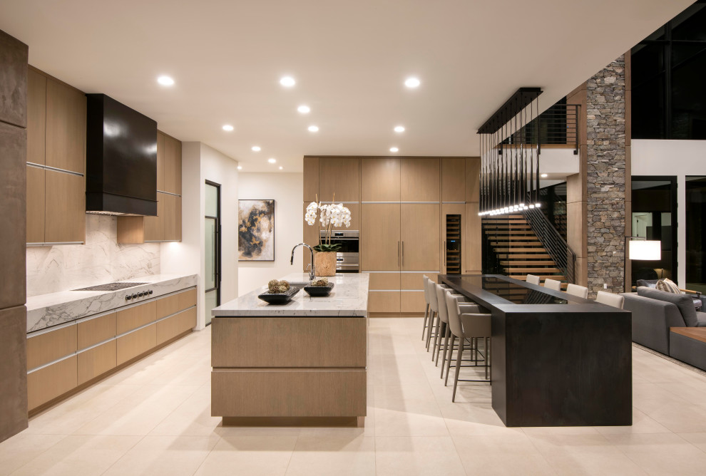 Design ideas for an expansive modern open plan kitchen in Phoenix with an undermount sink, flat-panel cabinets, wood benchtops, engineered quartz splashback, black appliances, with island and beige floor.