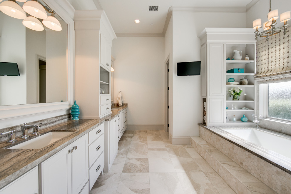 Expansive transitional master bathroom in Dallas with shaker cabinets, white cabinets, an undermount tub, a double shower, a two-piece toilet, beige tile, ceramic tile, white walls, ceramic floors, an undermount sink, granite benchtops, beige floor and a hinged shower door.