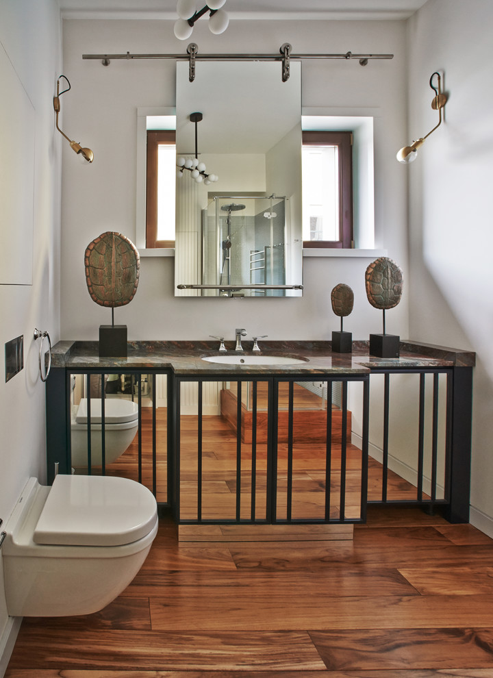 Inspiration for a contemporary 3/4 bathroom in Moscow with a wall-mount toilet, white walls, medium hardwood floors, an undermount sink and orange floor.