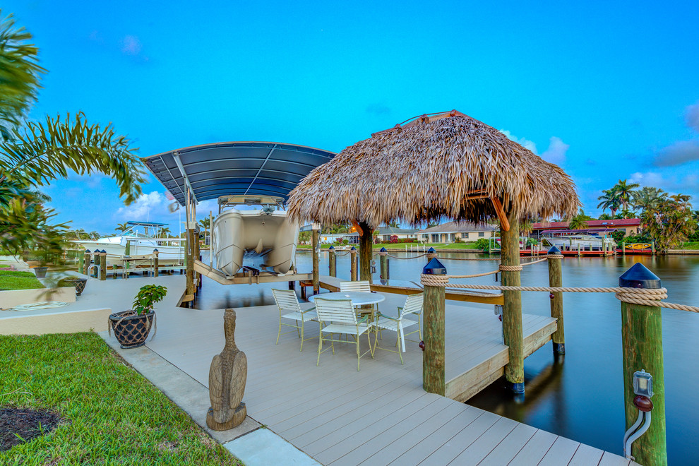 Large tropical backyard deck in Miami.