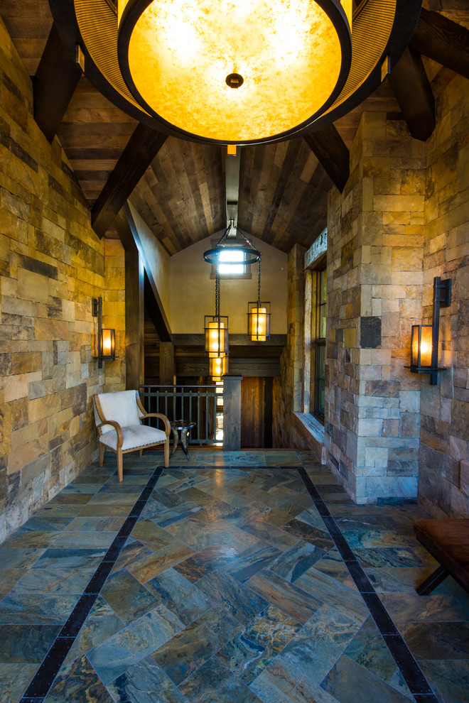 Inspiration for a large rustic granite floor and gray floor foyer remodel