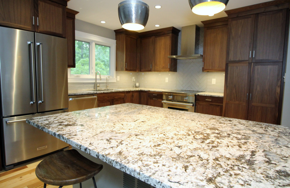 Inspiration for a mid-sized transitional l-shaped kitchen remodel with shaker cabinets, dark wood cabinets, ceramic backsplash, stainless steel appliances, an island and multicolored countertops