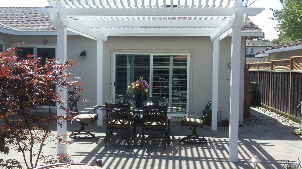 Inspiration for a mid-sized traditional backyard patio in San Francisco with a pergola.