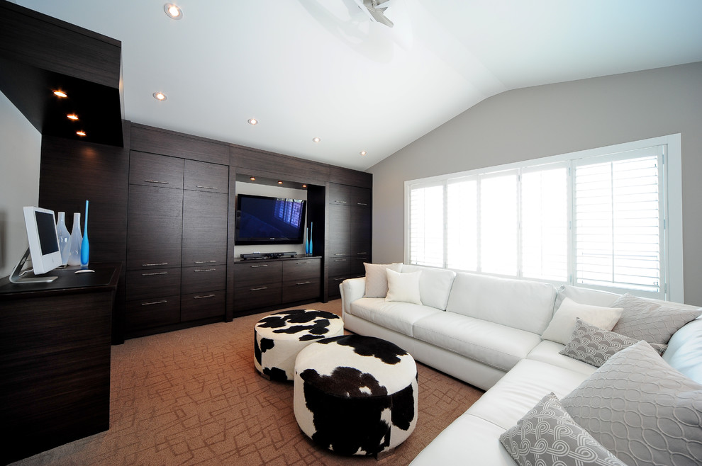 Contemporary family room in Calgary with grey walls.