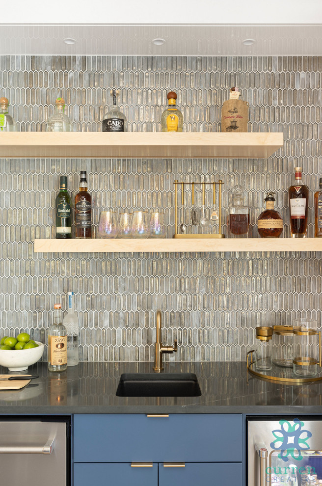 Design ideas for a small contemporary galley wet bar in Portland with a submerged sink, flat-panel cabinets, blue cabinets, engineered stone countertops, multi-coloured splashback, glass tiled splashback, laminate floors, beige floors and grey worktops.