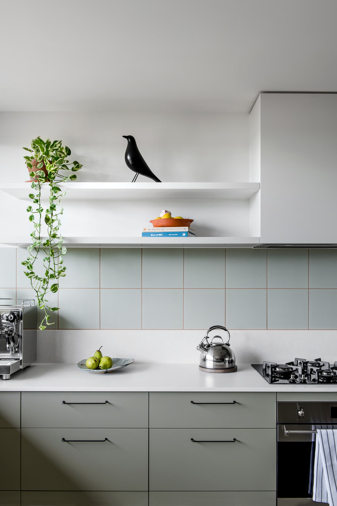 This is an example of a mid-sized midcentury kitchen in Brisbane.