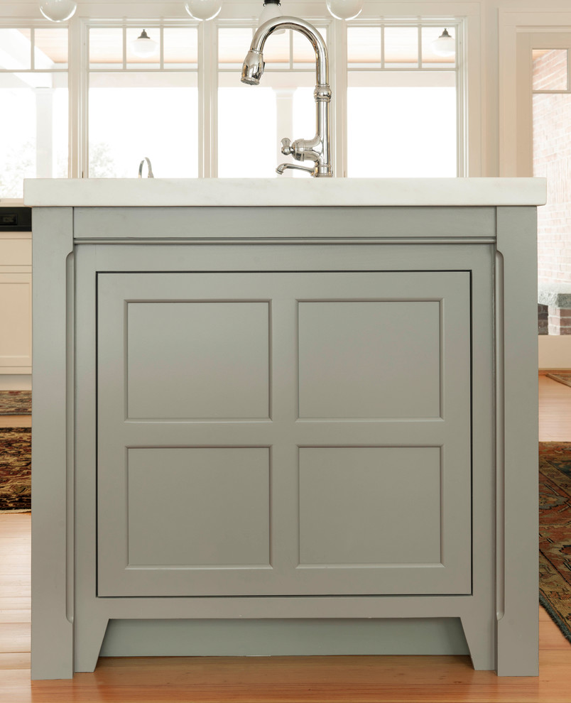 Inspiration for a large craftsman medium tone wood floor open concept kitchen remodel in Burlington with an undermount sink, recessed-panel cabinets, marble countertops, gray backsplash, marble backsplash, stainless steel appliances and an island