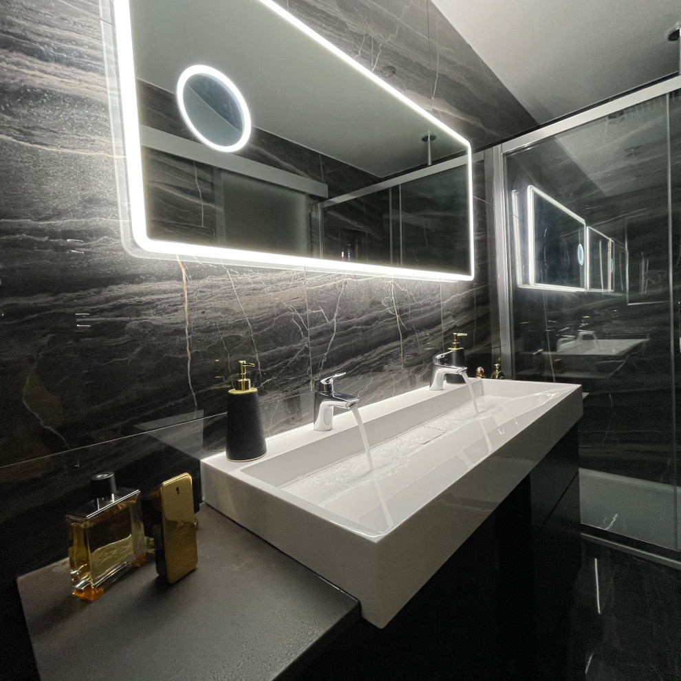 Example of a large minimalist kids' gray tile and porcelain tile marble floor, black floor and single-sink bathroom design in Buckinghamshire with a one-piece toilet, black walls, granite countertops, gray countertops and a freestanding vanity