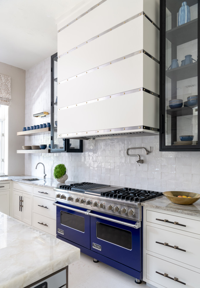 Inspiration for a large transitional kitchen in Dallas with recessed-panel cabinets, white cabinets, onyx benchtops, white splashback, terra-cotta splashback, coloured appliances, limestone floors, with island, white floor and white benchtop.