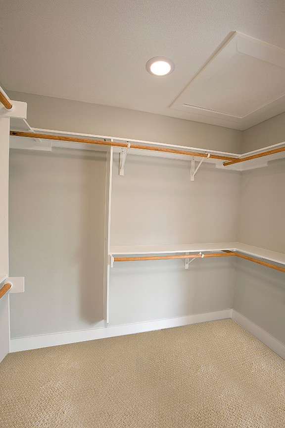 This is an example of a traditional storage and wardrobe in Austin.