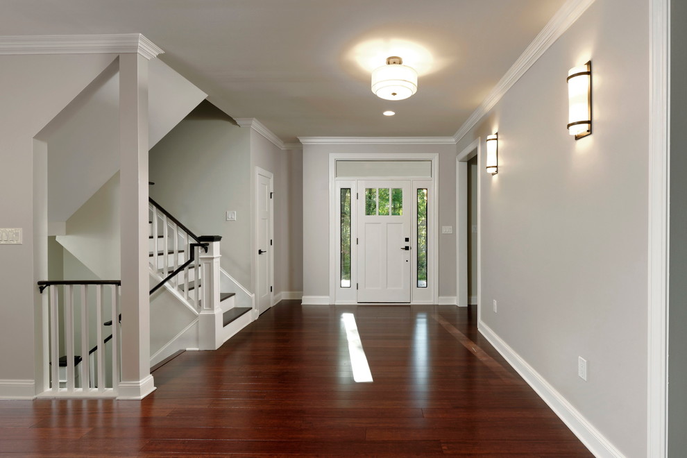 Inspiration for a mid-sized arts and crafts foyer in DC Metro with grey walls, bamboo floors, a single front door, a white front door and brown floor.