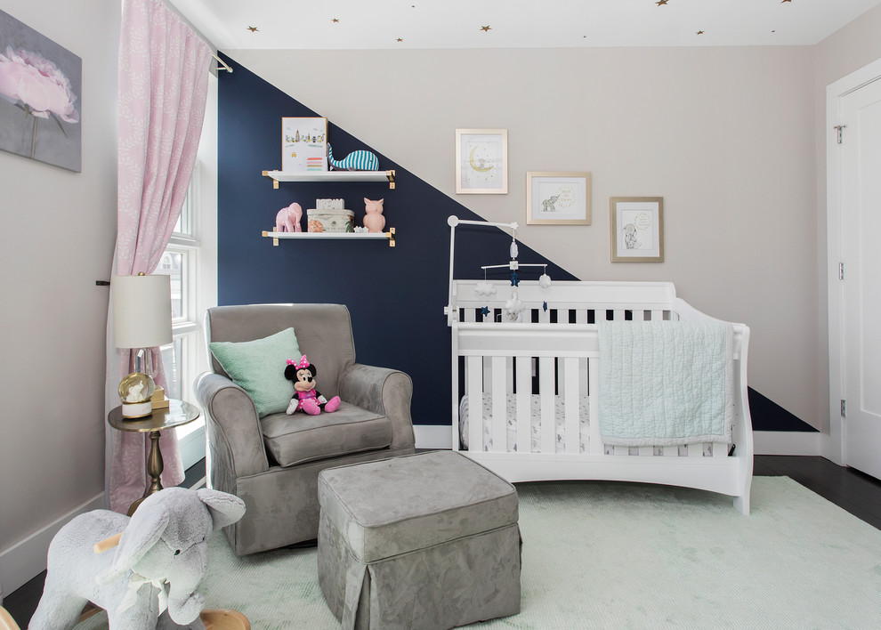 This is an example of a mid-sized transitional nursery in New York with grey walls, dark hardwood floors and brown floor.