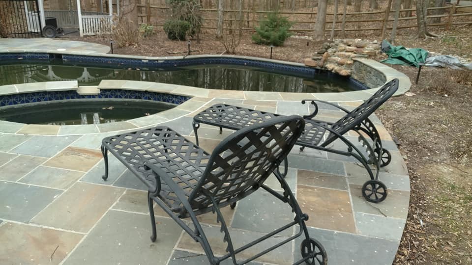 Inspiration for a huge transitional backyard stone and kidney-shaped natural pool remodel