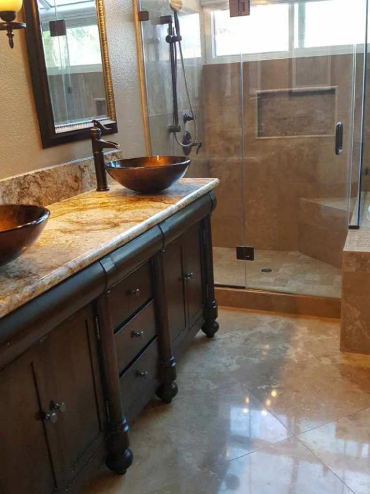 Inspiration for a small traditional master bathroom in Orange County with an open shower, brown tile, stone tile, brown walls, mosaic tile floors, a vessel sink, brown floor, brown benchtops, an enclosed toilet and a double vanity.