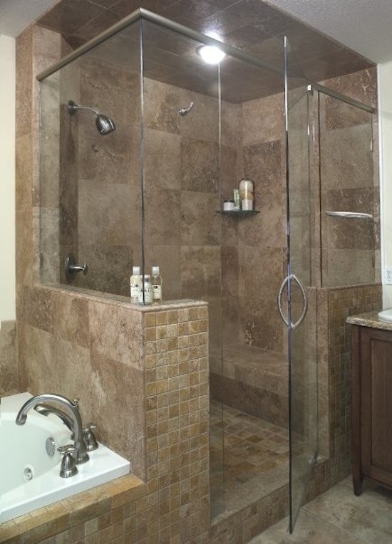 Design ideas for a mid-sized contemporary master bathroom in Richmond with raised-panel cabinets, dark wood cabinets, a drop-in tub, an alcove shower, brown tile, travertine, beige walls, travertine floors, a drop-in sink, granite benchtops, beige floor and a hinged shower door.