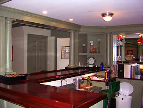 Enclosed kitchen - mid-sized transitional enclosed kitchen idea in Boston with open cabinets, green cabinets and wood countertops
