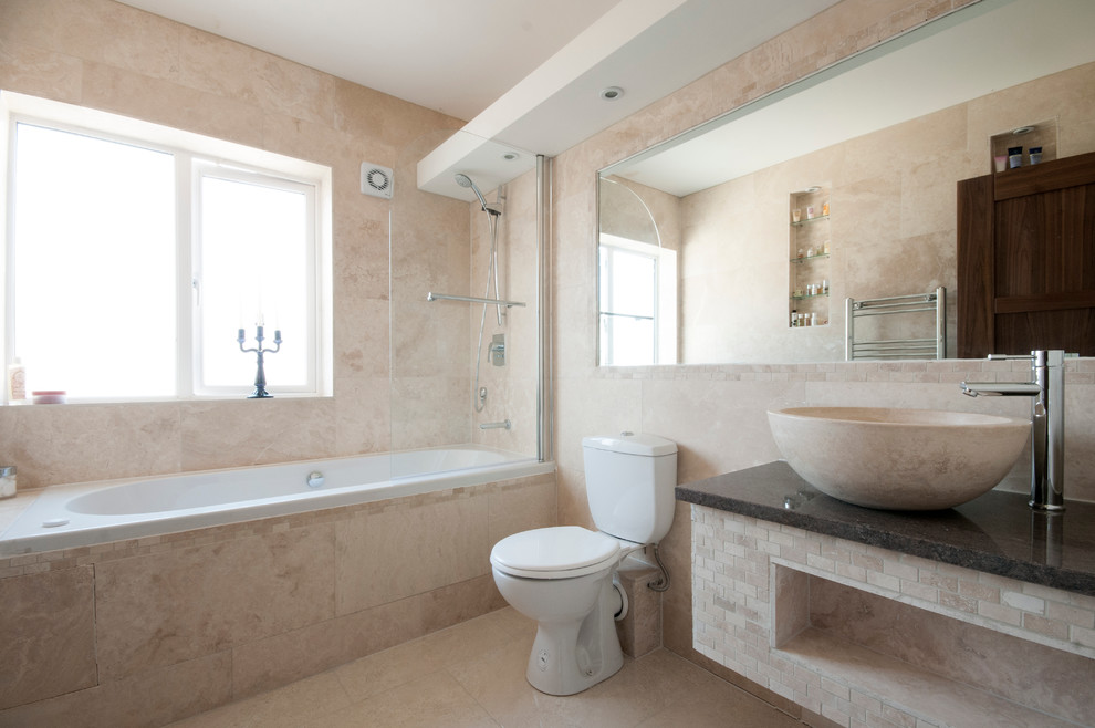 Photo of a mid-sized country kids bathroom in Dublin with beige tile, stone tile, blue walls and porcelain floors.