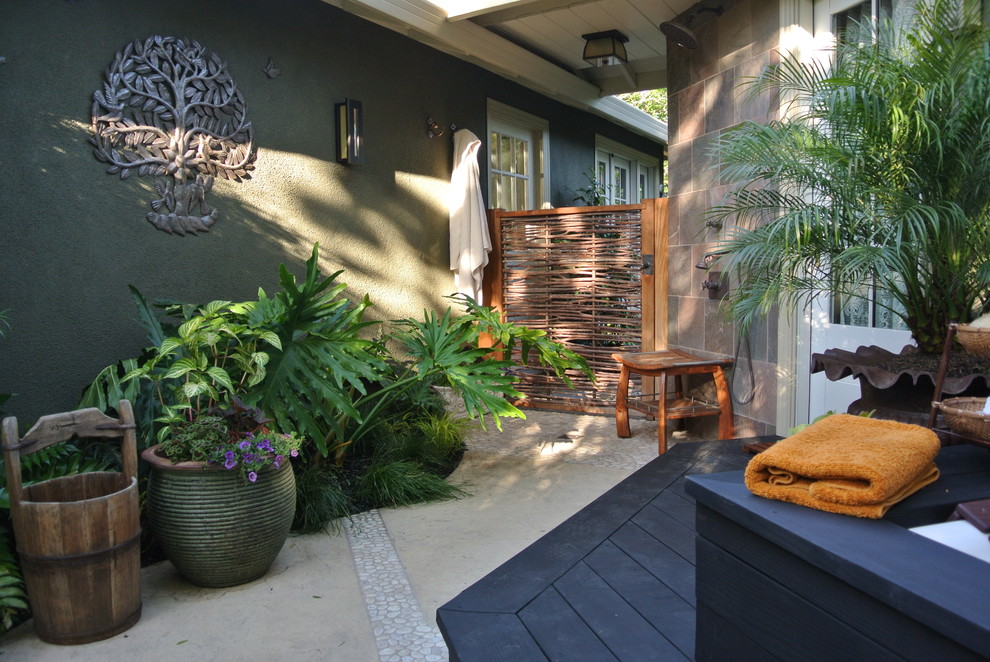 Design ideas for a small tropical backyard patio in San Francisco with decking, a roof extension and an outdoor shower.