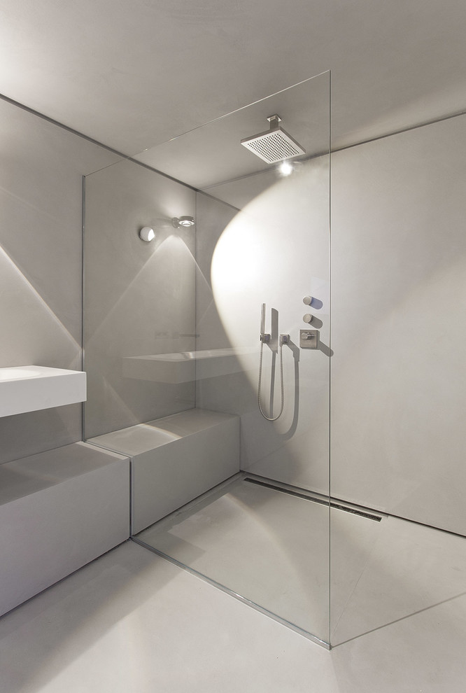 Large contemporary bathroom in Berlin with an open shower, grey walls, a wall-mount sink and an open shower.