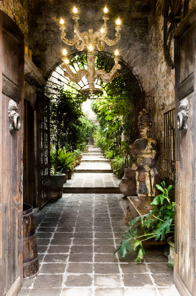 Inspiration for a mediterranean entryway in Other with a double front door and a medium wood front door.