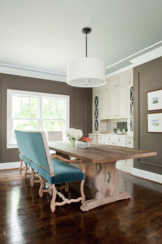 This is an example of a mid-sized traditional kitchen/dining combo in Atlanta with brown walls and dark hardwood floors.