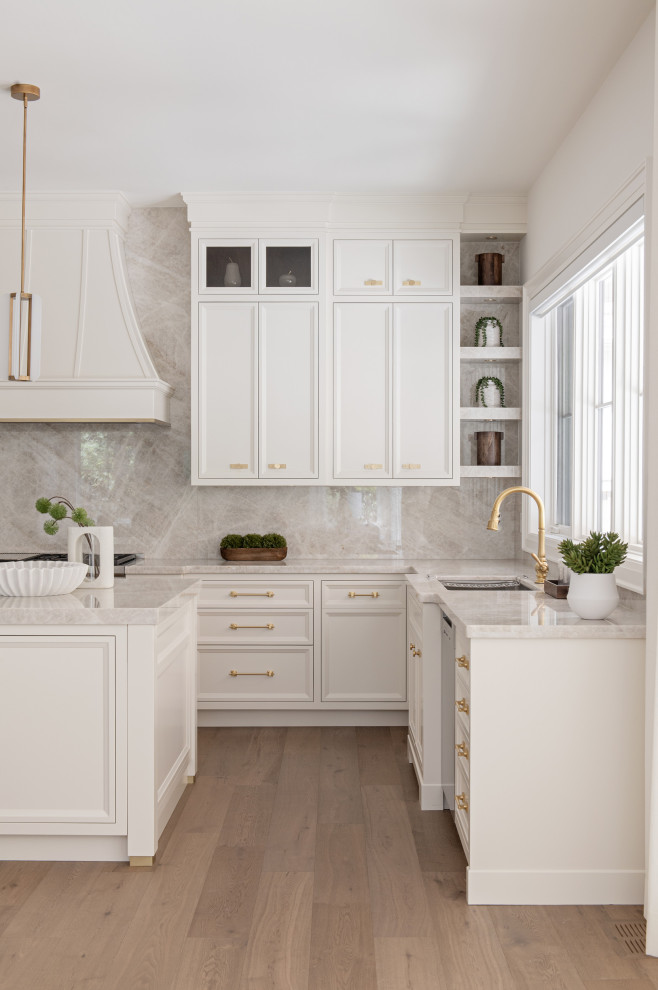 Eat-in kitchen - large transitional u-shaped light wood floor eat-in kitchen idea in Toronto with an undermount sink, recessed-panel cabinets, white cabinets, quartz countertops, multicolored backsplash, quartz backsplash, stainless steel appliances, an island and multicolored countertops