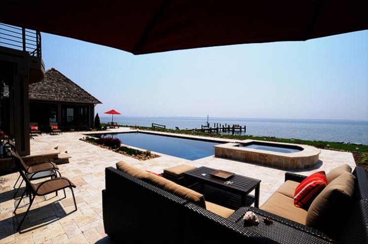 Example of a large transitional backyard stone and rectangular lap hot tub design in Baltimore