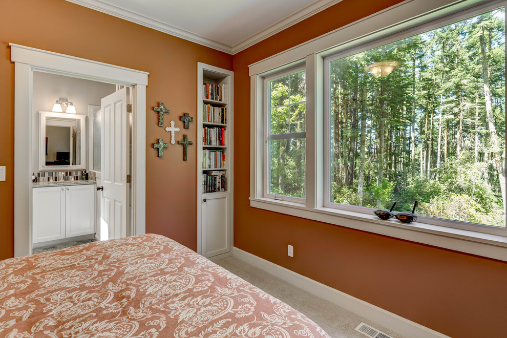 This is an example of a mid-sized arts and crafts master bedroom in Seattle with carpet, orange walls, no fireplace and grey floor.