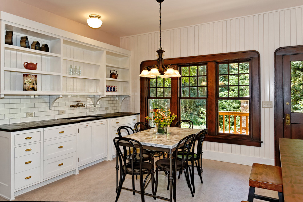 Photo of a traditional eat-in kitchen in San Francisco with recessed-panel cabinets.