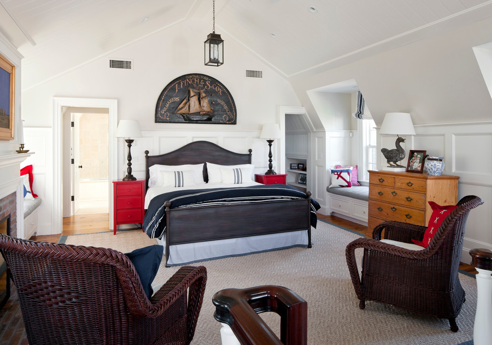 This is an example of a beach style bedroom in Boston with white walls.