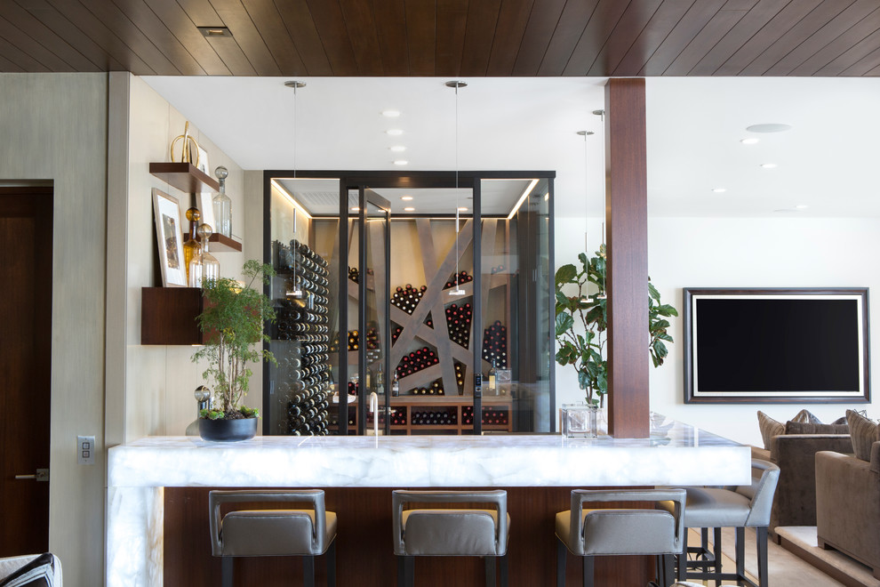 This is an example of a contemporary home bar in Orange County.