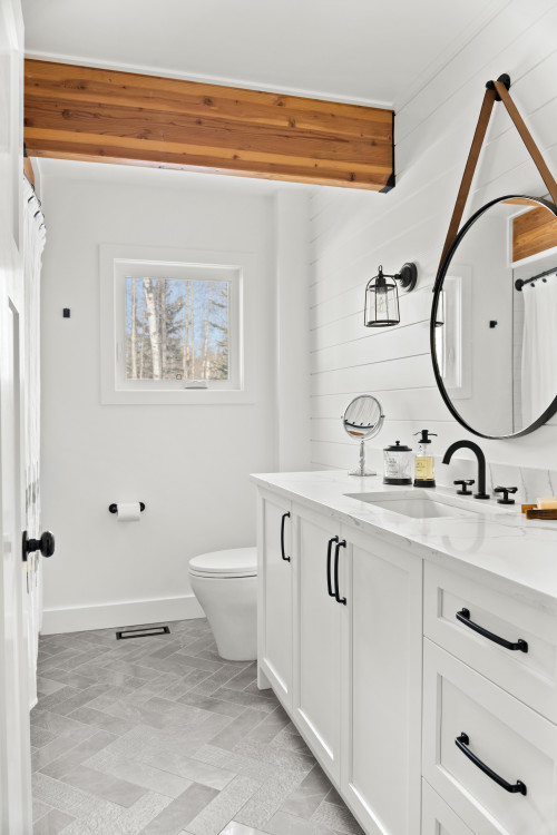White Bathroom With Gray Ceramic Herringbone Tile Floors