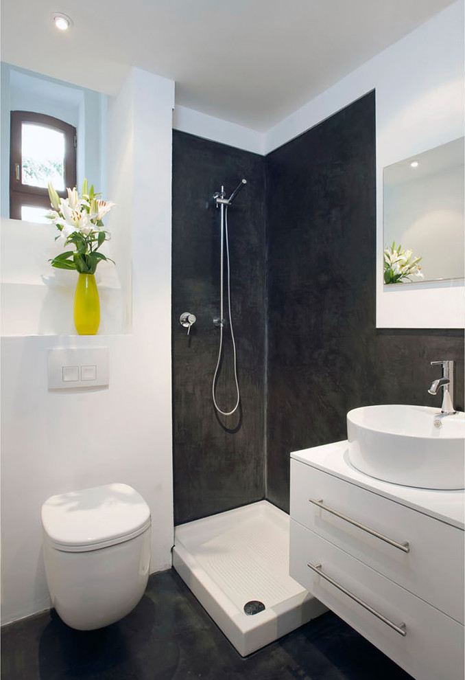 Design ideas for a small contemporary 3/4 bathroom in Cologne with a vessel sink, flat-panel cabinets, white cabinets, a corner shower, a wall-mount toilet and white walls.