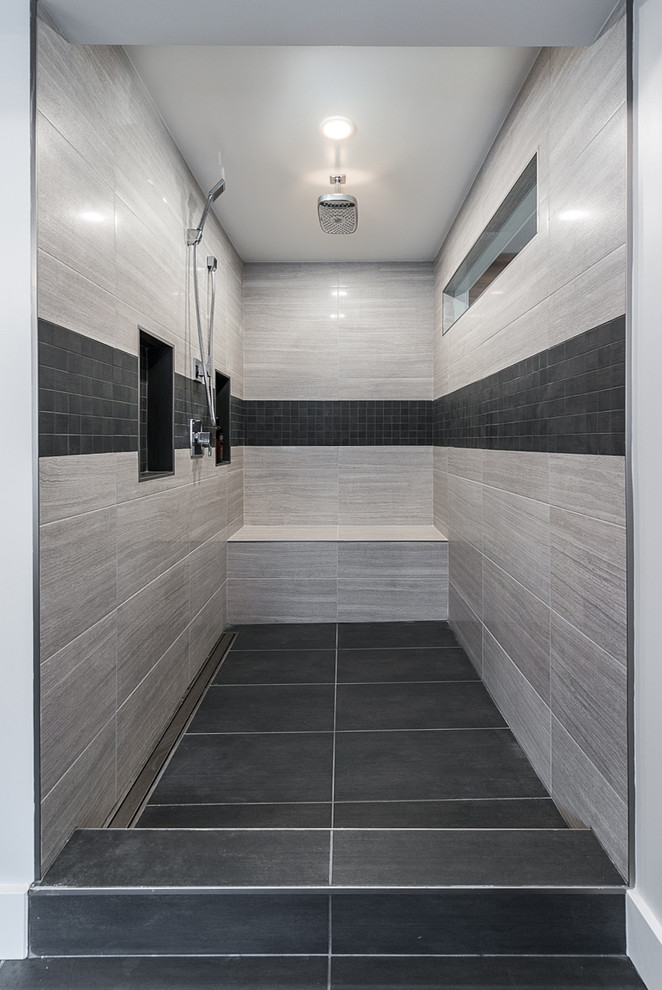 This is an example of a mid-sized contemporary master bathroom in Vancouver with flat-panel cabinets, distressed cabinets, an open shower, a one-piece toilet, grey walls and an integrated sink.