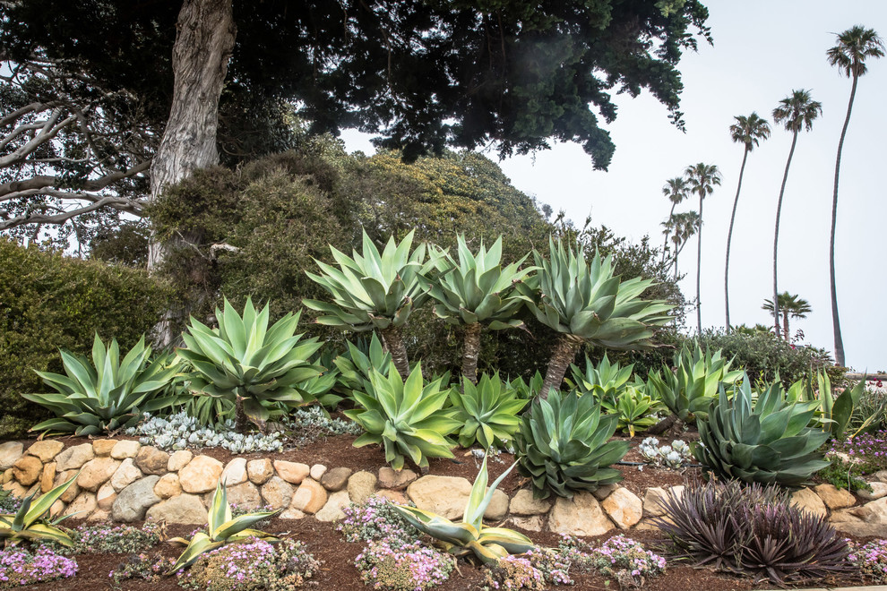Inspiration for a mediterranean backyard garden in Santa Barbara with natural stone pavers.