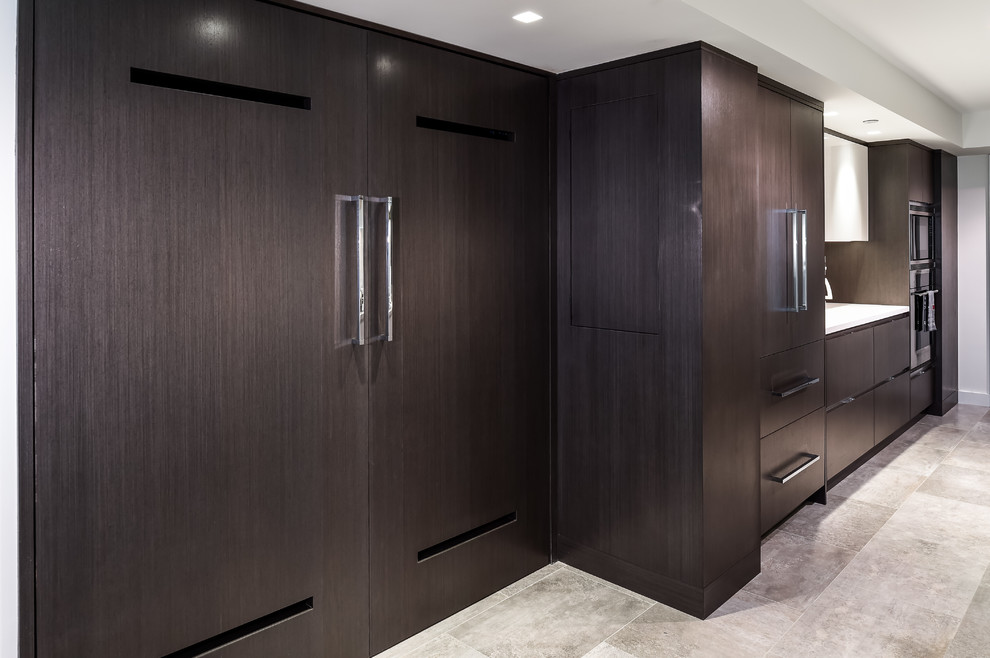 Design ideas for a large modern single-wall separate kitchen in Miami with flat-panel cabinets and dark wood cabinets.